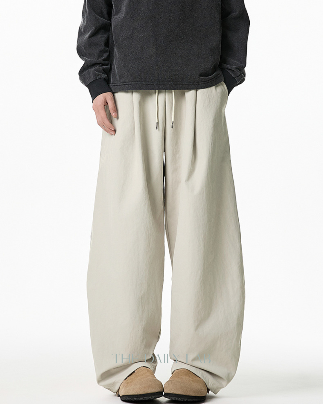 Pleated Loose-Fit Curved-Leg Pants in Beige