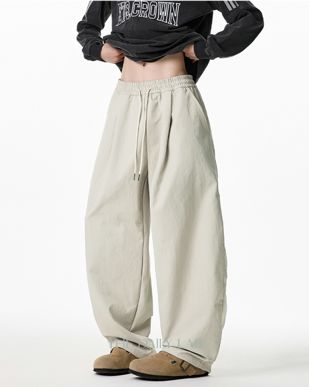 Pleated Loose-Fit Curved-Leg Pants in Beige