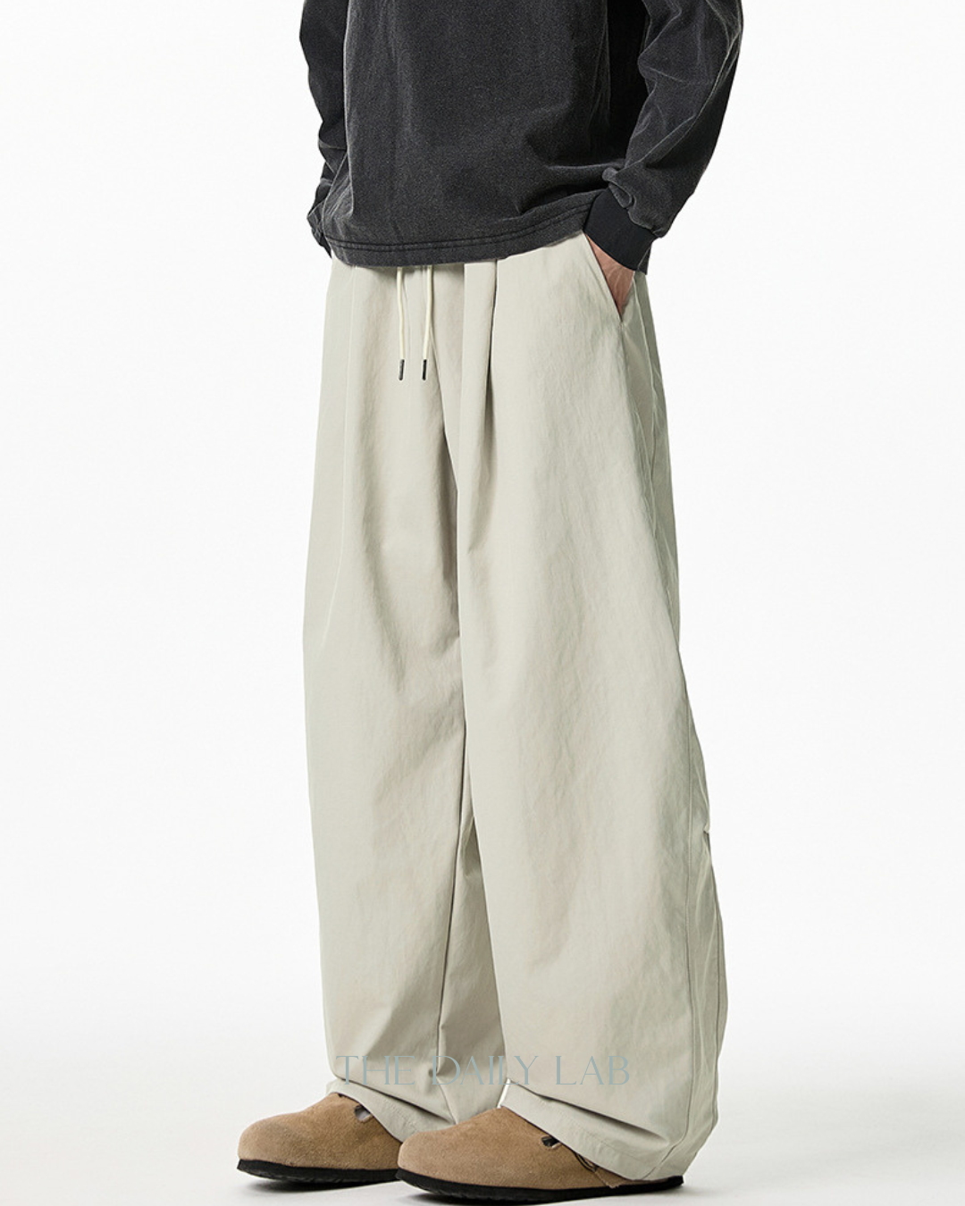 Pleated Loose-Fit Curved-Leg Pants in Beige