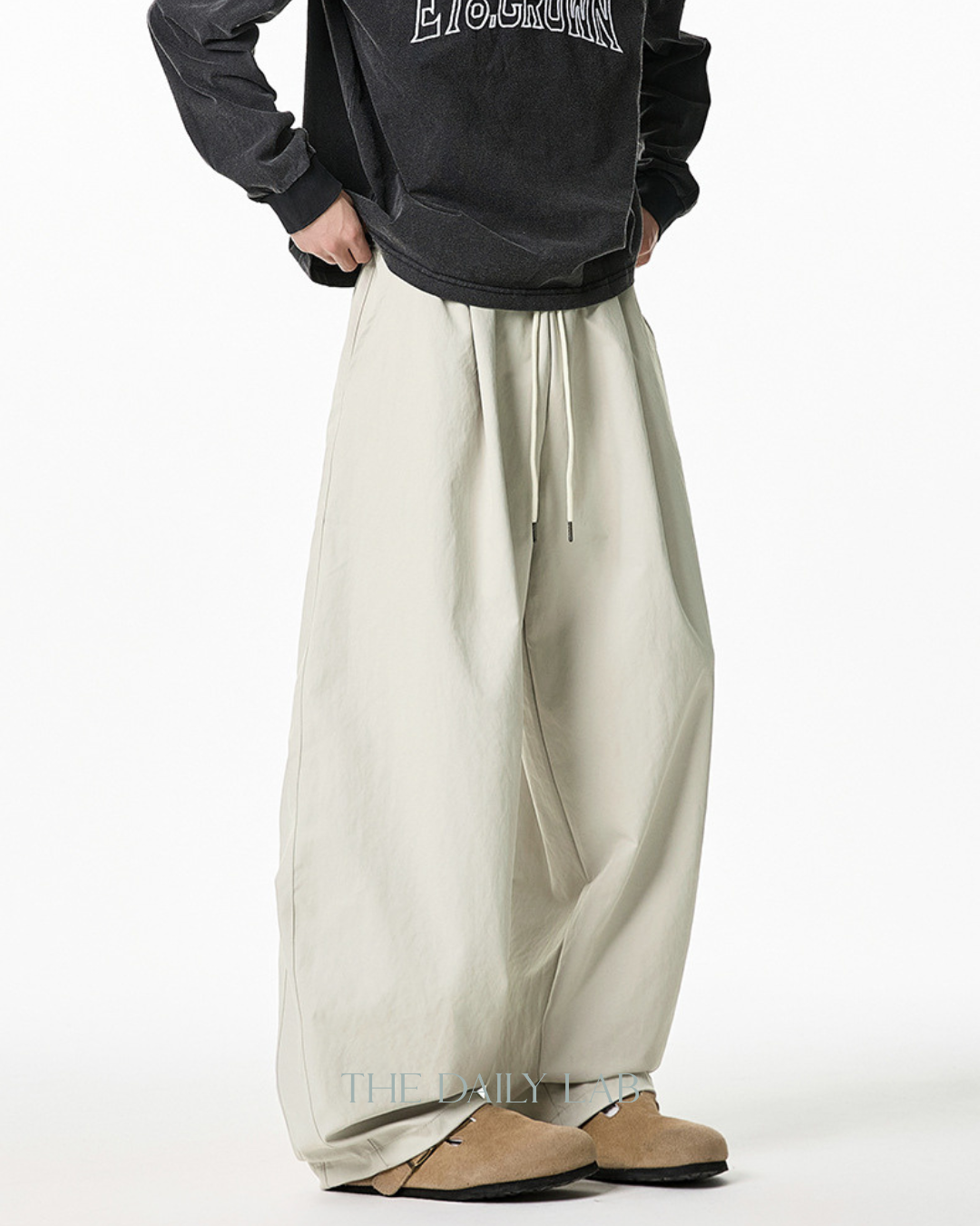 Pleated Loose-Fit Curved-Leg Pants in Beige