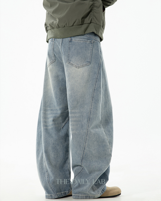 Structured Segmented Washed and Distressed Curved Blade Jeans In Blue