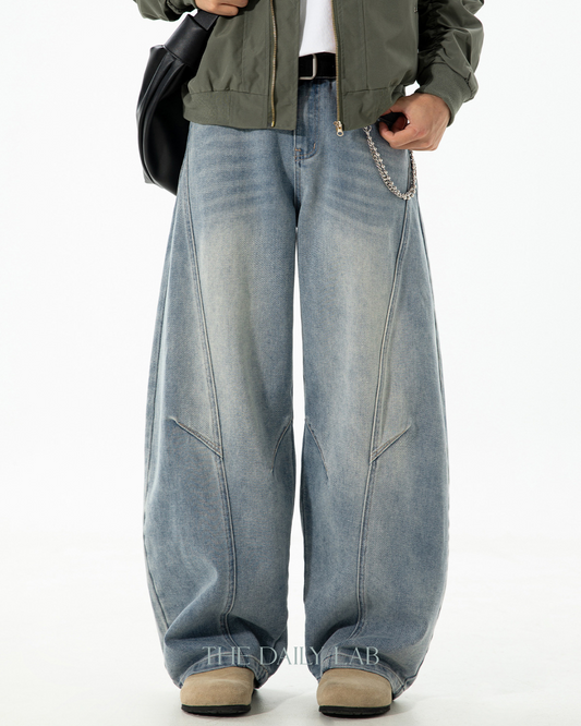 Structured Segmented Washed and Distressed Curved Blade Jeans In Blue